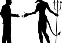 man shaking hands with the devil